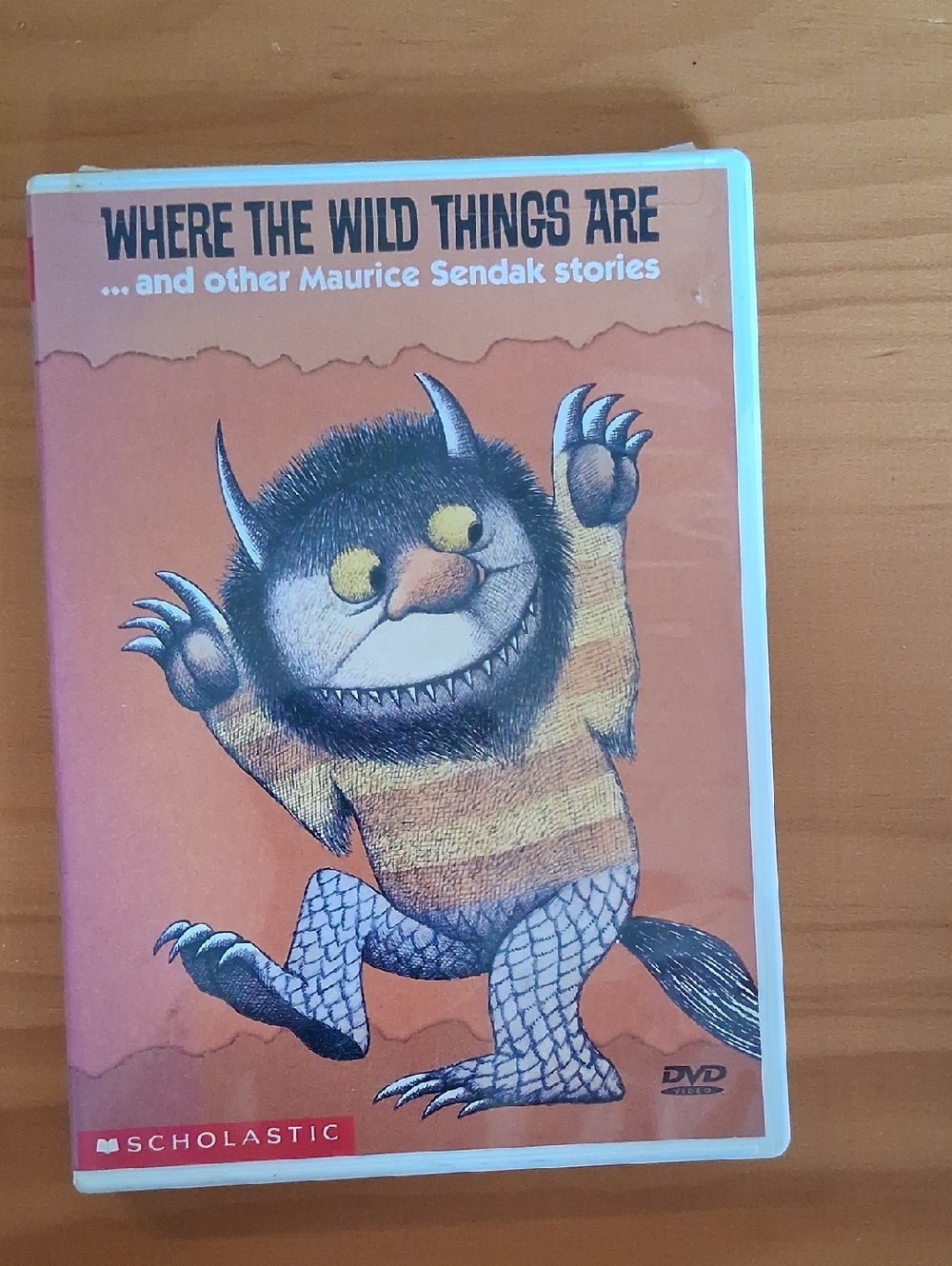 Scholastic Orange Cover DVD - Striped Monster Illustration